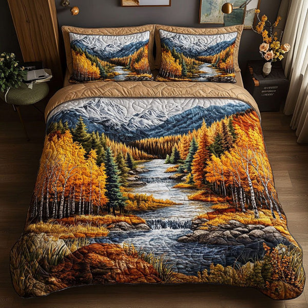 Golden Autumn Stream quilted 3-piece bedding set on a made bed with two matching pillow shams