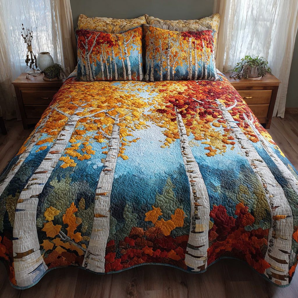 Golden Birches quilted 3-piece bedding set on a made bed with two matching pillow shams
