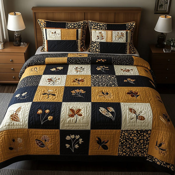 Golden Bloom quilted 3-piece bedding set on a made bed with two matching pillow shams
