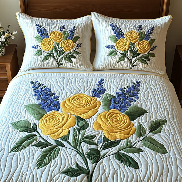 Golden Bloom quilted 3-piece bedding set on a made bed with two matching pillow shams