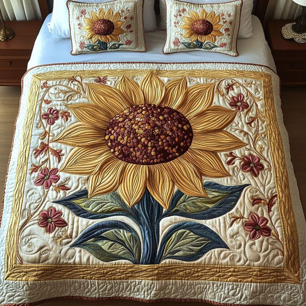 Golden Blooms quilted 3-piece bedding set on a made bed with two matching pillow shams