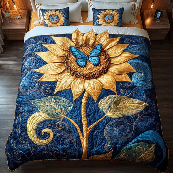 Golden Butterfly Glow quilted 3-piece bedding set on a made bed with two matching pillow shams