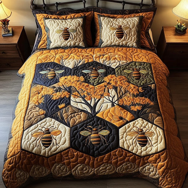Golden Buzz quilted 3-piece bedding set on a made bed with two matching pillow shams