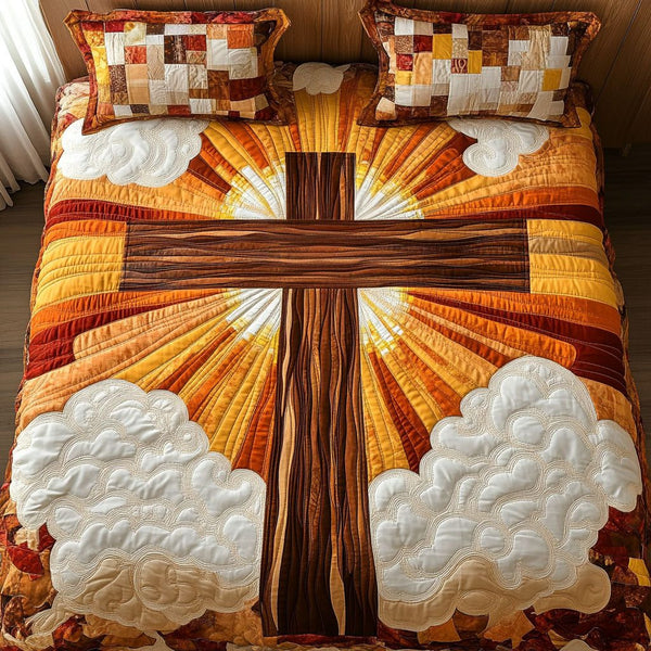 Golden Cross Sunrise quilted 3-piece bedding set on a made bed in a softly lit bedroom