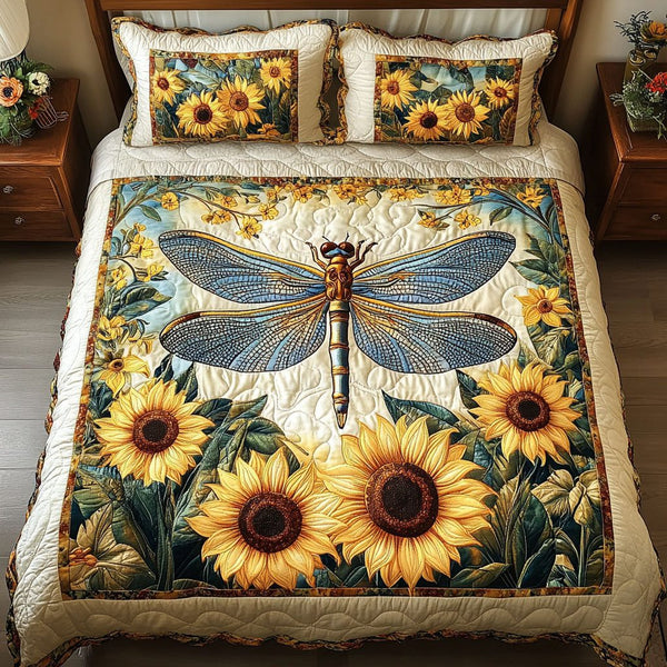 Golden Dragonfly Garden quilted 3-piece bedding set on a made bed with two matching pillow shams