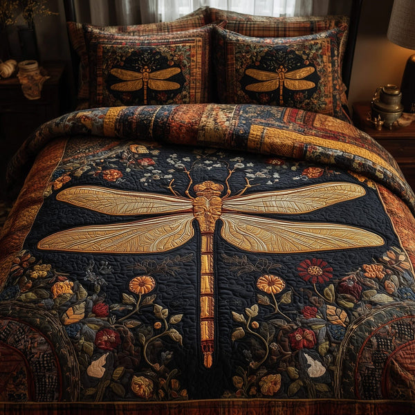 Golden Dragonfly quilted 3-piece bedding set on a made bed with two matching pillow shams
