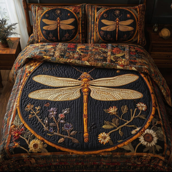 Golden dragonfly quilted 3-piece bedding set on a made bed with two matching pillow shams