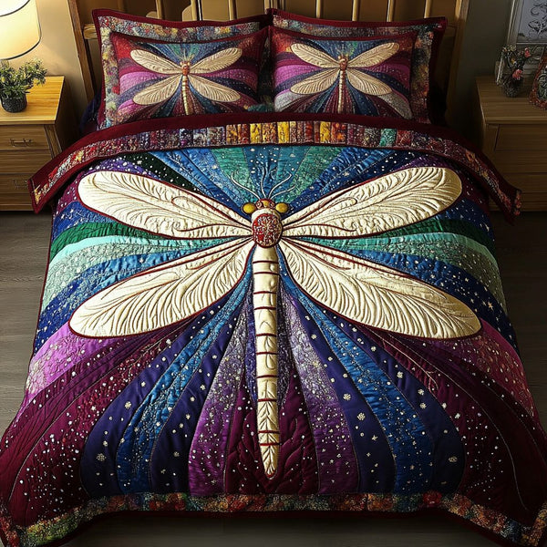 Golden Dragonfly quilted 3-piece bedding set on a made bed with two matching pillow shams