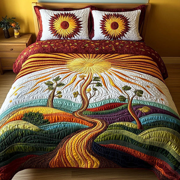 Golden Fields Reverie quilted 3-piece bedding set on a made bed with two matching pillow shams