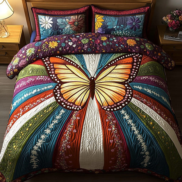 Golden Flight quilted 3-piece bedding set on a made bed with two matching pillow shams