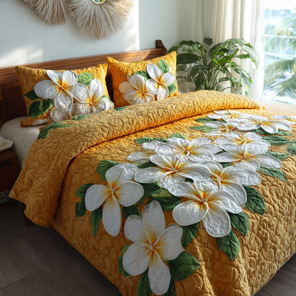 Golden Flora quilted 3-piece bedding set on a made bed with two matching pillow shams