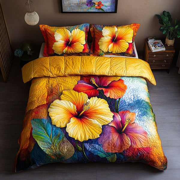 Golden Hibiscus Dream quilted 3-piece bedding set on a made bed with two matching pillow shams