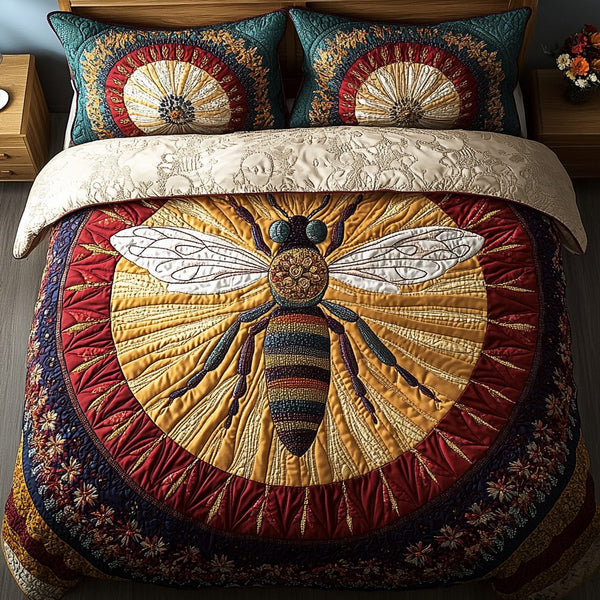 Golden Hive Guardian quilted 3-piece bedding set on a made bed with two matching pillow shams