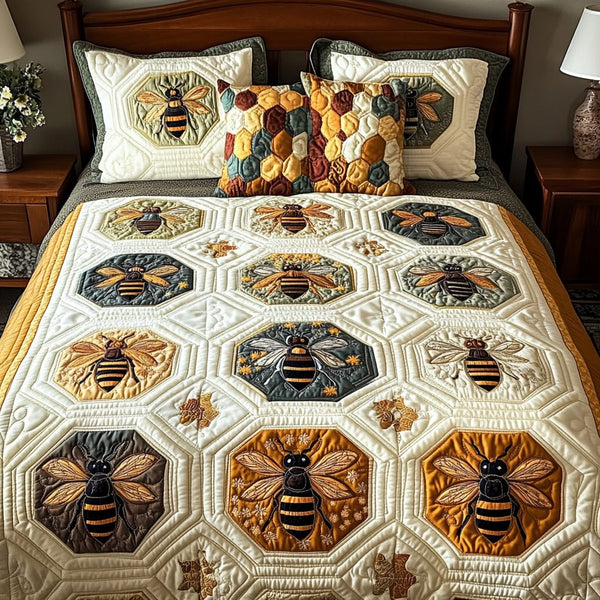 Golden Hives quilted 3-piece bedding set on a made bed with two matching pillow shams