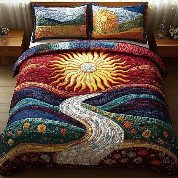 Golden Hour Dreams quilted 3-piece bedding set on a made bed with two matching pillow shams