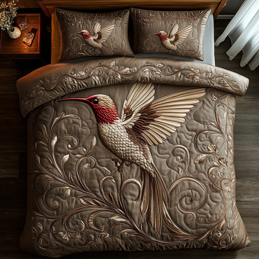 Golden Hummingbird quilted 3-piece bedding set on a made bed with two matching pillow shams