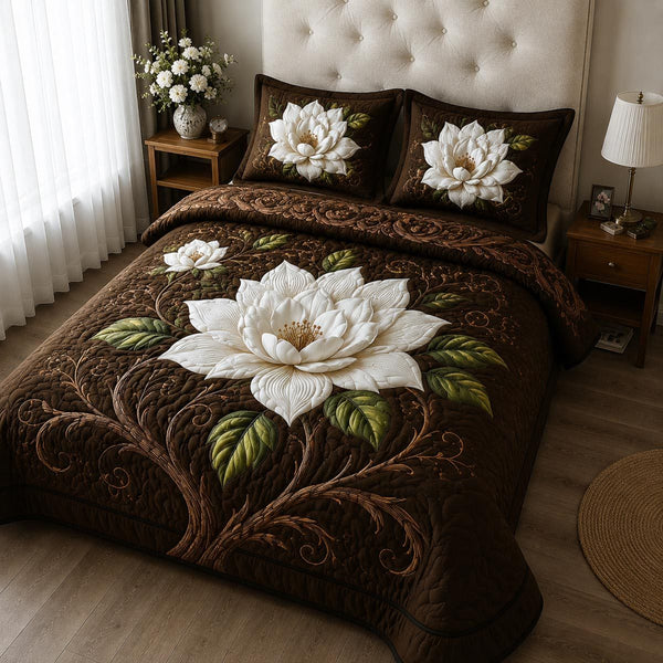 Golden Magnolia quilted 3-piece bedding set on a made bed with two matching pillow shams