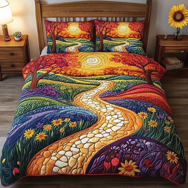 Golden Meadows quilted 3-piece bedding set on a made bed with two matching pillow shams