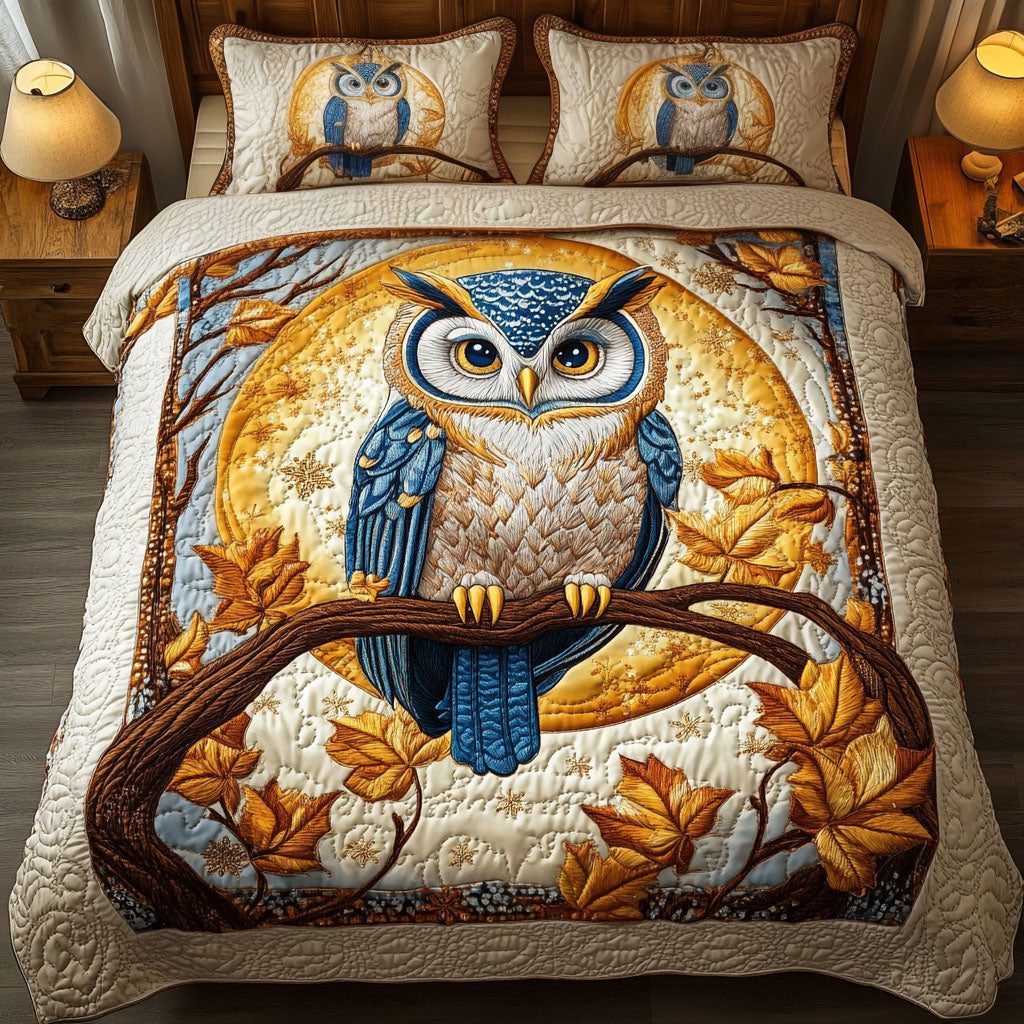 Golden Owl quilted 3-piece bedding set on a made bed with two matching pillow shams