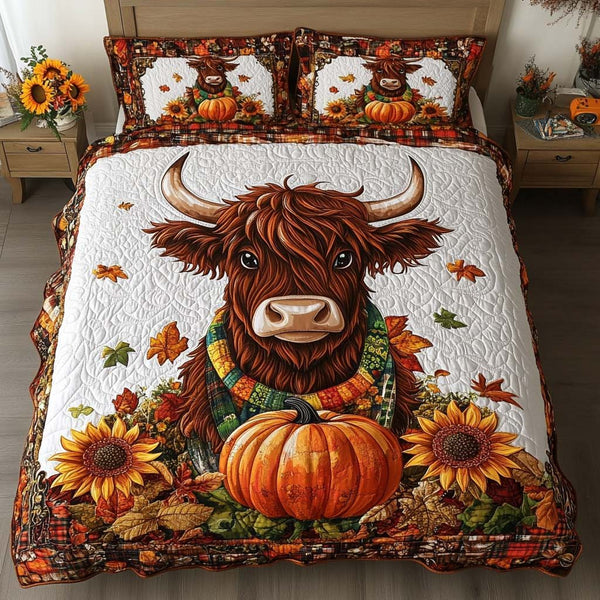 Golden Pasture quilted 3-piece bedding set on a made bed with two matching pillow shams