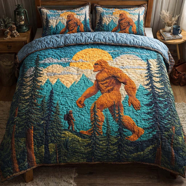 Golden Peak Bigfoot quilted 3-piece bedding set on a made bed with two matching pillow shams