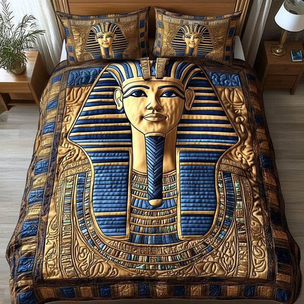 Golden Pharaoh quilted 3-piece bedding set on a made bed with two matching pillow shams