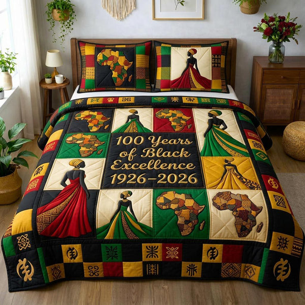 Golden Queen quilted 3-piece bedding set on a made bed with two matching pillow shams