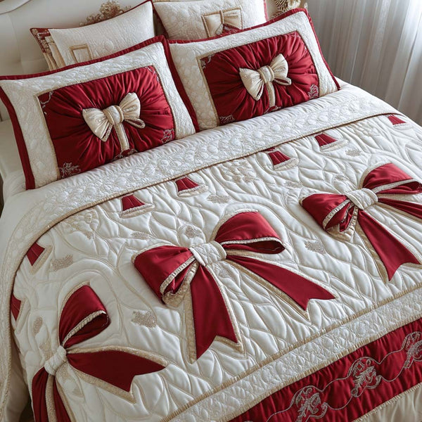 Golden Ribbon Charm quilted 3-piece bedding set on a made bed with two matching pillow shams