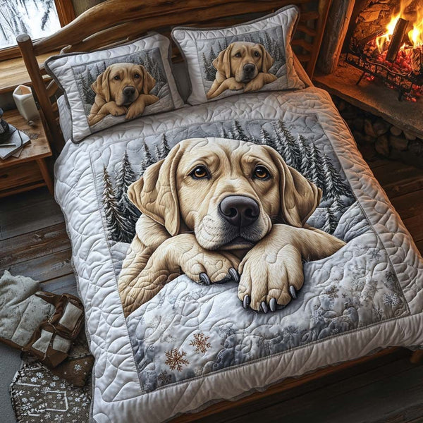 Golden Slumber quilted 3-piece bedding set on a made bed with two matching pillow shams