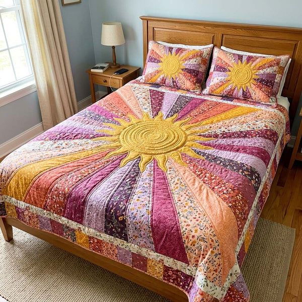 Golden Sunrise quilted 3-piece bedding set on a made bed with two matching pillow shams