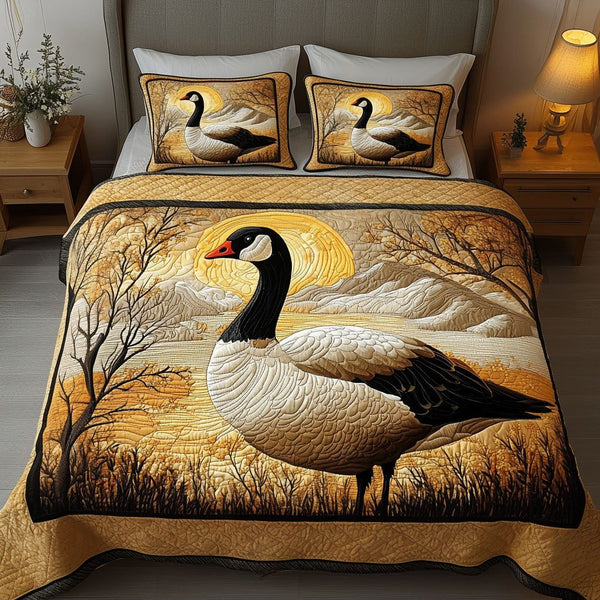 Golden Sunrise quilted 3-piece bedding set on a made bed with two matching pillow shams