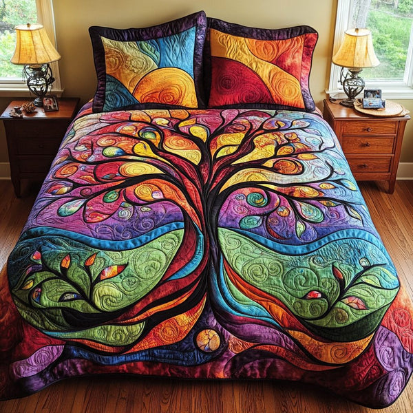 Golden Tree of Life quilted 3-piece bedding set on a made bed with two matching pillow shams