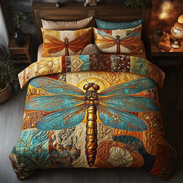 Golden Wings Elegance quilted 3-piece bedding set on a made bed with two matching pillow shams