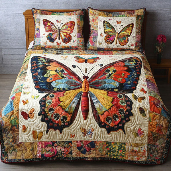 Golden Wings quilted 3-piece bedding set on a made bed with two matching pillow shams