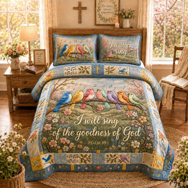 Goodness Song Birds quilted 3-piece bedding set on a made bed with two matching pillow shams