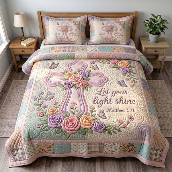Grace In Bloom quilted 3-piece bedding set on a made bed with two matching pillow shams
