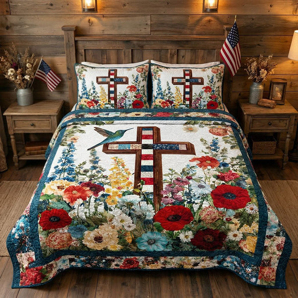 Grace in Bloom quilted 3-piece bedding set on a made bed with two matching pillow shams