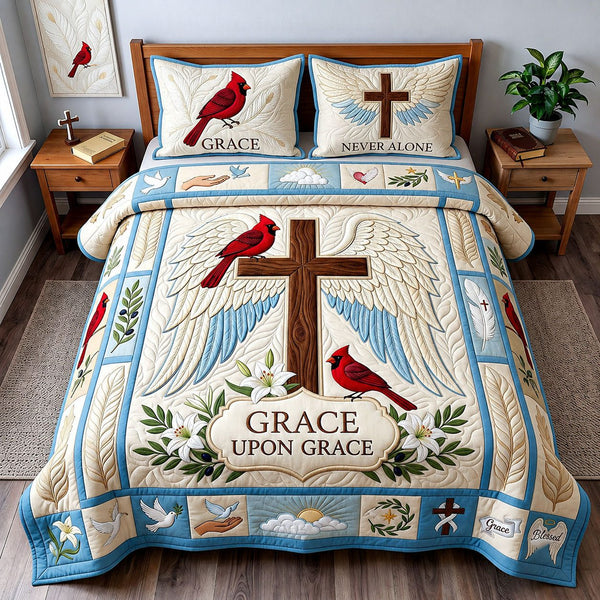 Grace Upon Grace quilted 3-piece bedding set on a made bed with two matching pillow shams