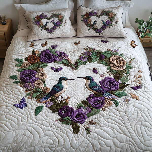 Graceful Garden quilted 3-piece bedding set on a made bed with two matching pillow shams