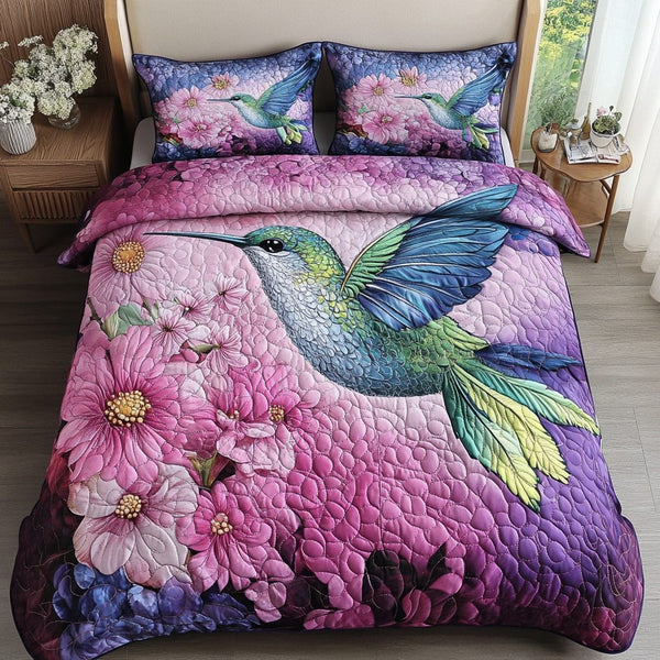 Graceful Hover quilted 3-piece bedding set on a made bed with two matching pillow shams