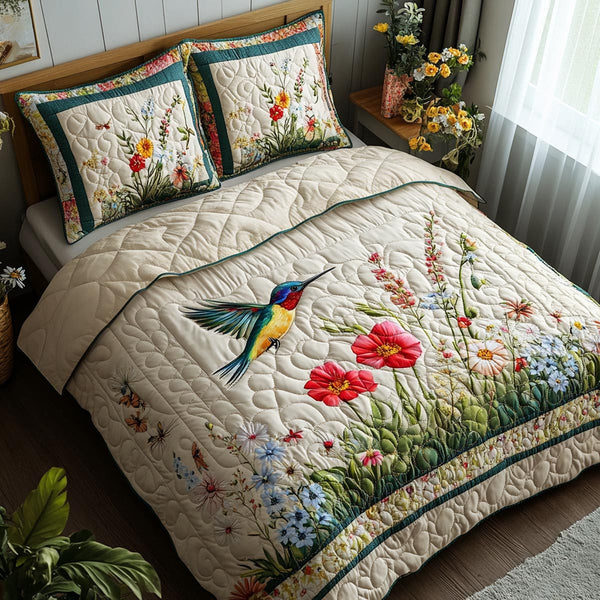 Graceful Wings quilted 3-piece bedding set on a made bed with two matching pillow shams