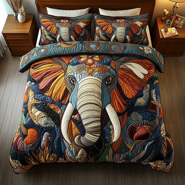 Gray Grace Designs quilted 3-piece bedding set on a made bed with two matching pillow shams
