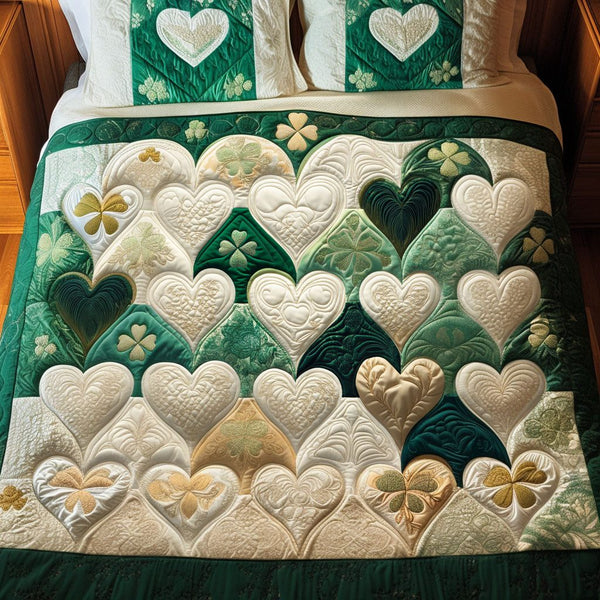 Green Harmony quilted 3-piece bedding set on a made bed with two matching pillow shams