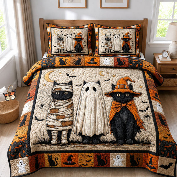 Halloween Black Cats quilted 3-piece bedding set on a made bed against a dark styled interior