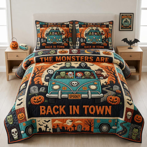 Halloween Town quilted 3-piece bedding set on a made bed against a dark styled interior