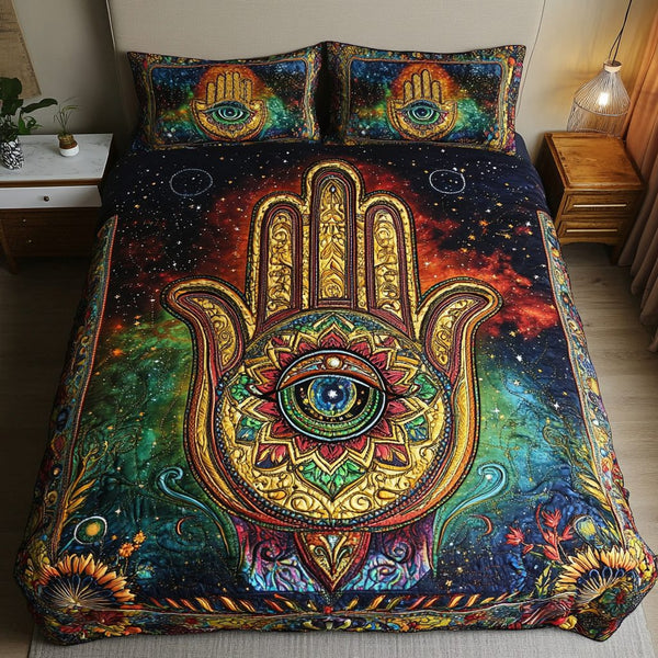 Hamsa Blessing quilted 3-piece bedding set on a made bed with two matching pillow shams