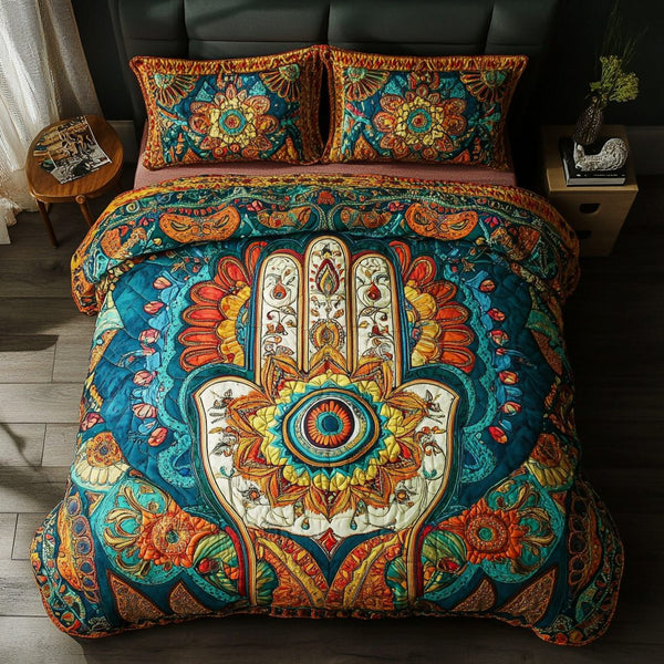 Hamsa Energy quilted 3-piece bedding set on a made bed with two matching pillow shams