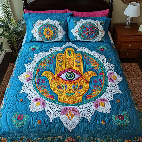 Hamsa Harmony quilted 3-piece bedding set on a made bed with two matching pillow shams