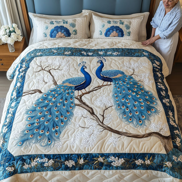 Happily Ever Peacocks quilted 3-piece bedding set on a made bed with two matching pillow shams