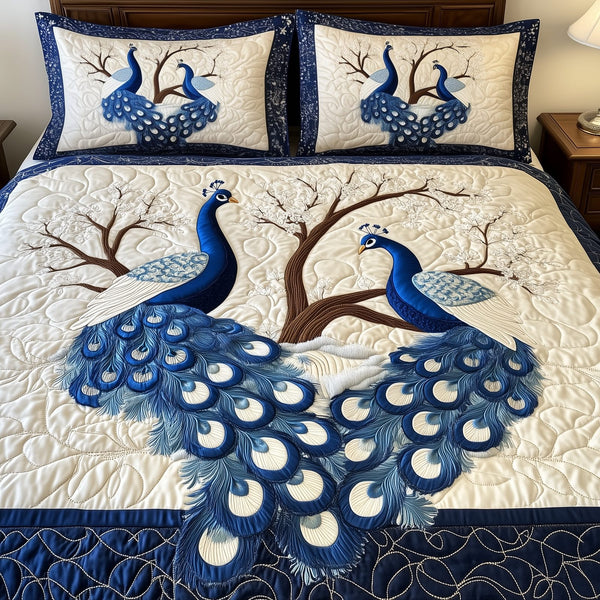 Happily Ever Peacocks quilted 3-piece bedding set on a made bed with two matching pillow shams